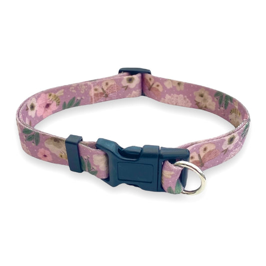 a photo of a dusty pink floral no escape safe cinch dog collar by fearless pet on a white background
