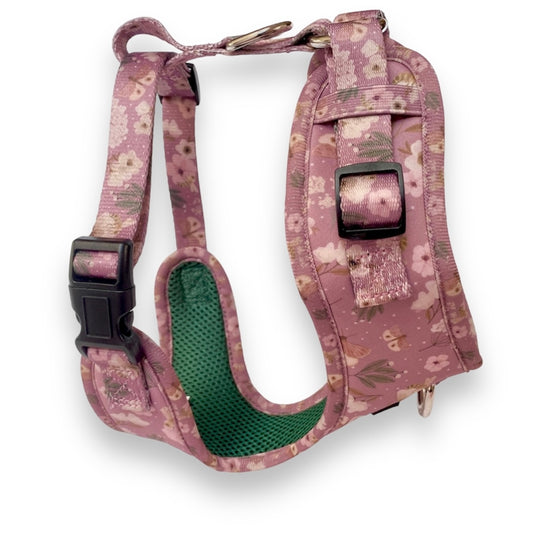 a 3D image of an escape proof small dog harness from Fearless pet in a dusty pink color with flowers and bees