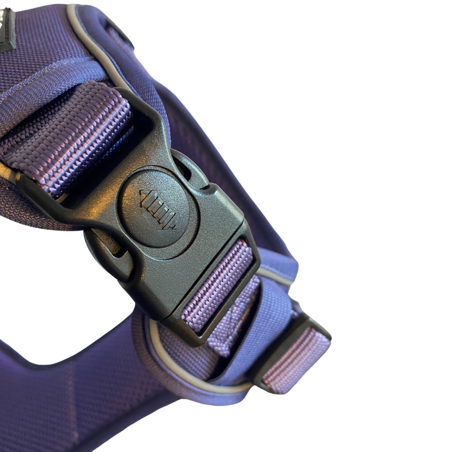 a close up image of a locking neck buckle on a no escape dog harness by fearless pet in the dark lavender color