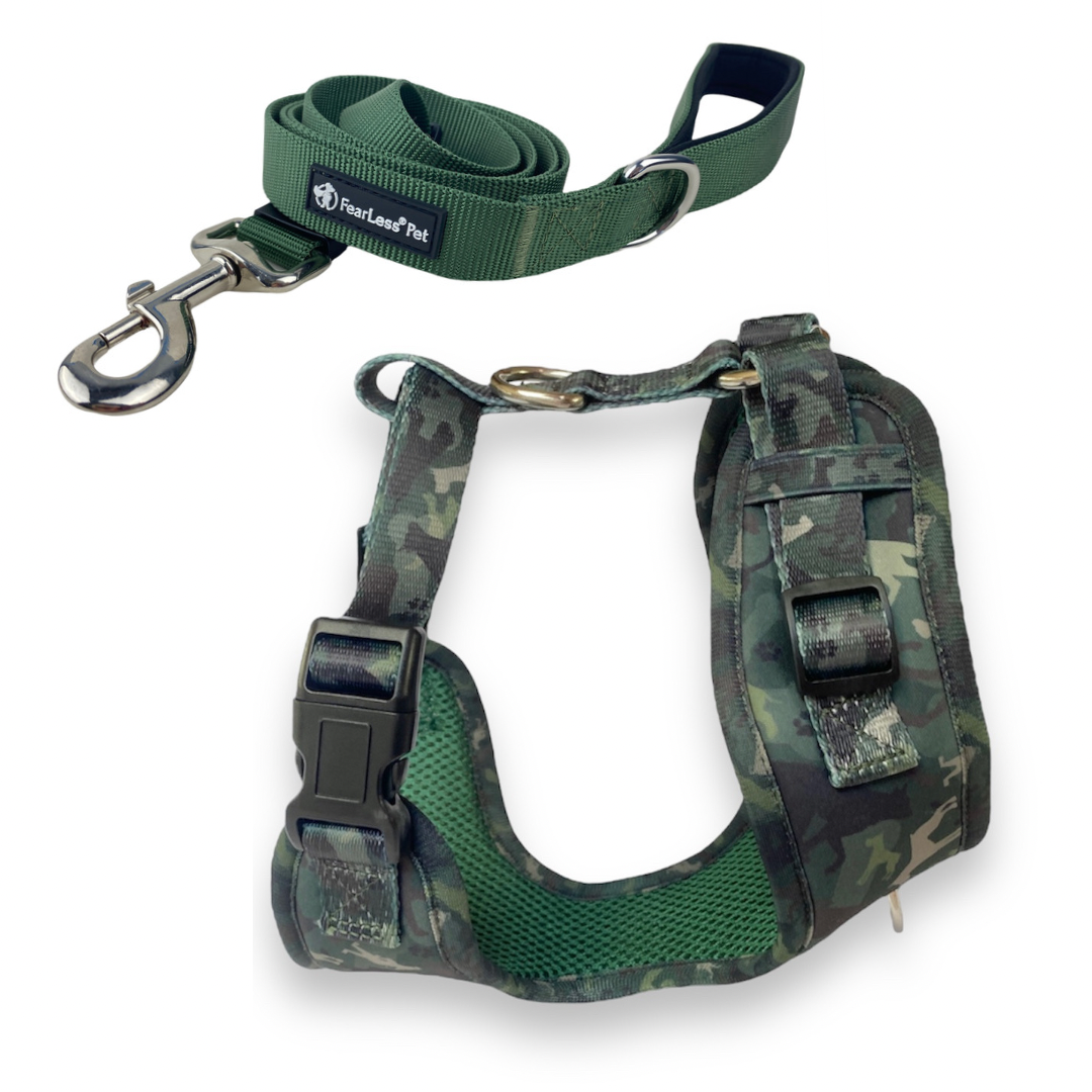 a product photo on a white background of a neoprene no pull dog harness in a green camouflage pattern and a solid forest green adjustable dog Leash from fearless pet