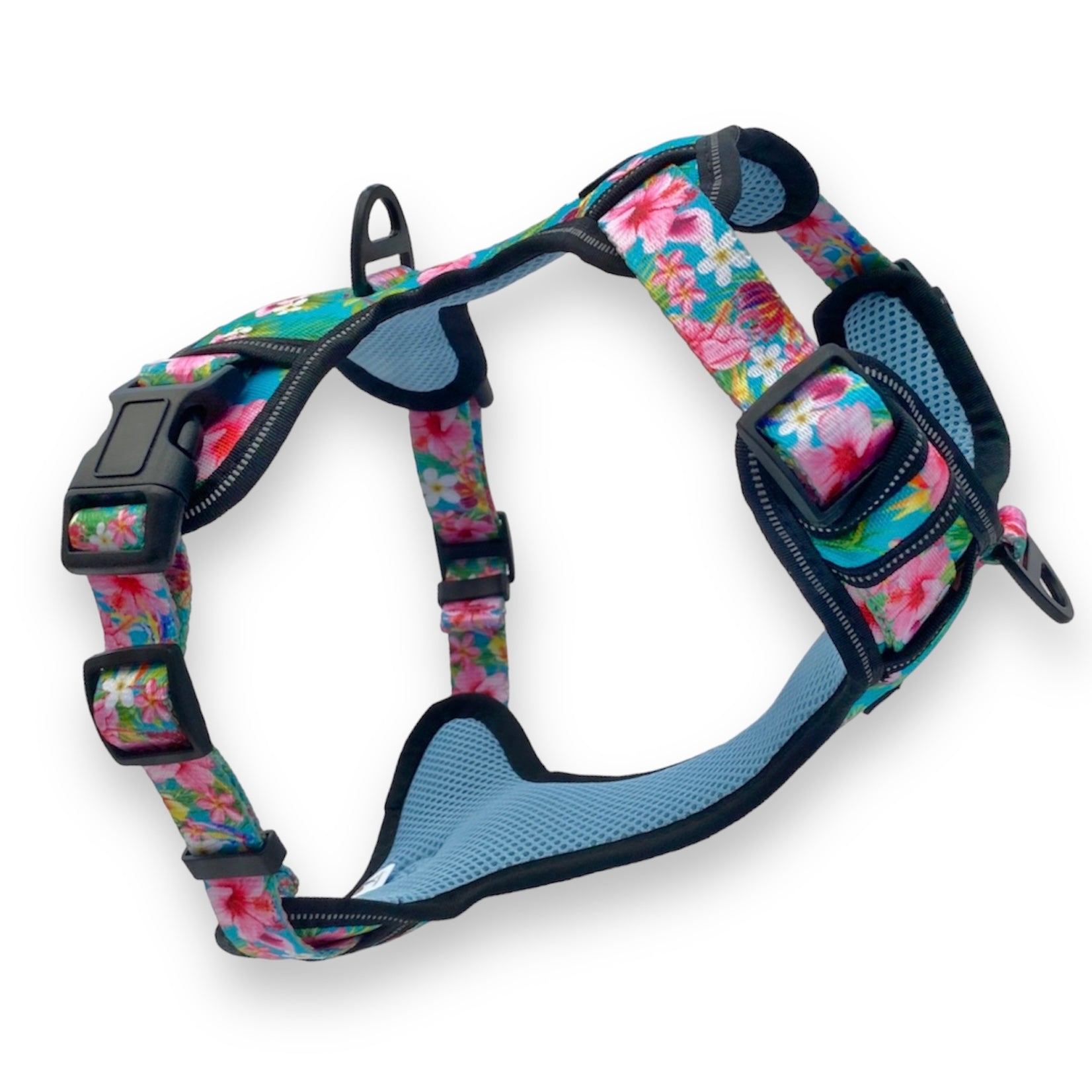 a 3d image of an escape proof dog harness from fearless pet in a bright pink floral pattern with a teal blue background
